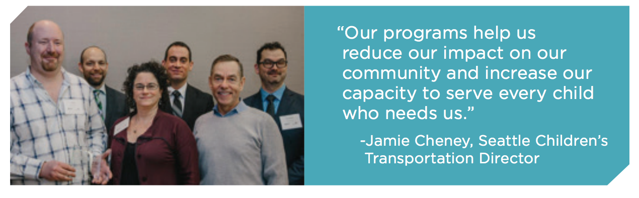 An image of a group of five smiling people. The quote to the right says:  “Our programs help us  reduce our impact on our  community and increase our  capacity to serve every child  who needs us.” -Jamie Cheney, Seattle Children’s  Transportation Director